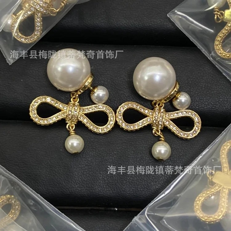 25 early spring Dijia/Djia earrings big and small pearl stars pig nose CD earrings new temperament bow earrings